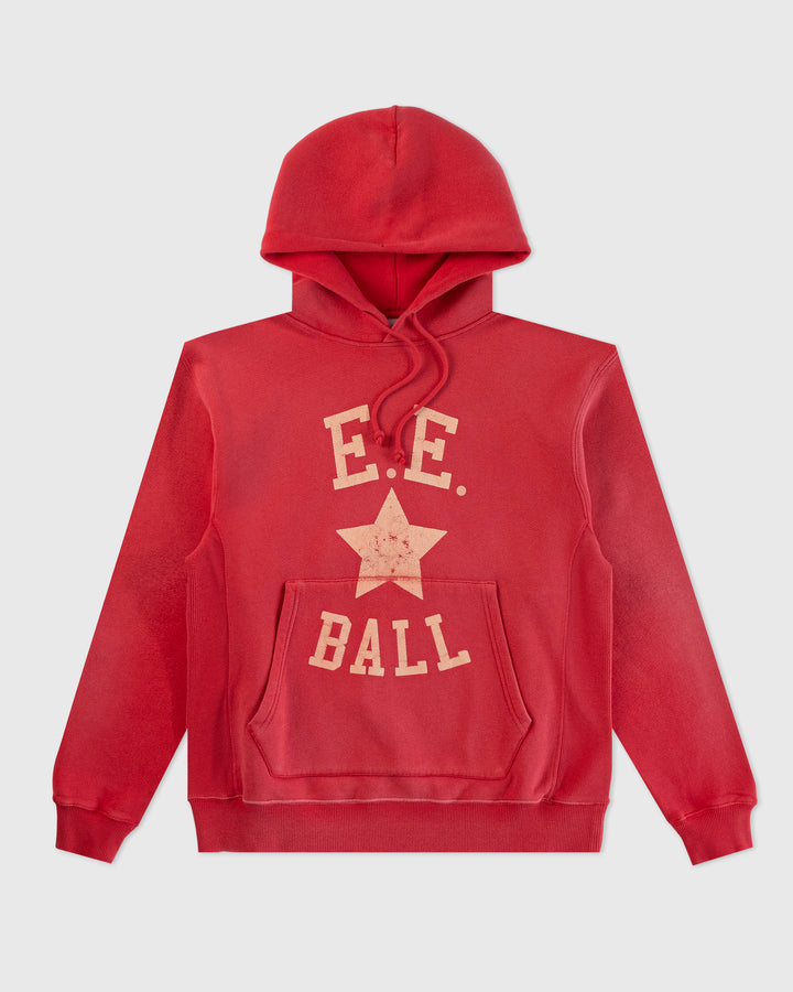 a red sweatshirt with a white star on it