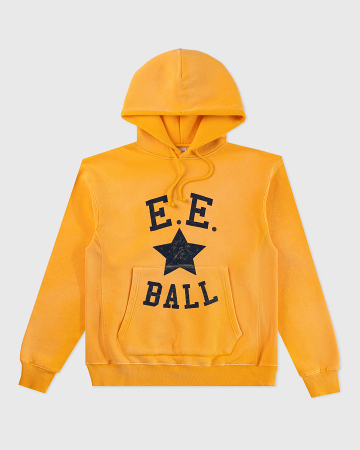 a yellow sweatshirt with a black star on it